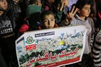 <p>A protester holds a banner during the protest against the plan of Jerusalem’s recognition at the Jabaliya Refugee Camp in Gaza City, Gaza on Dec. 6, 2017. (Photo: Mustafa Hassona/Anadolu Agency/Getty Images) </p>