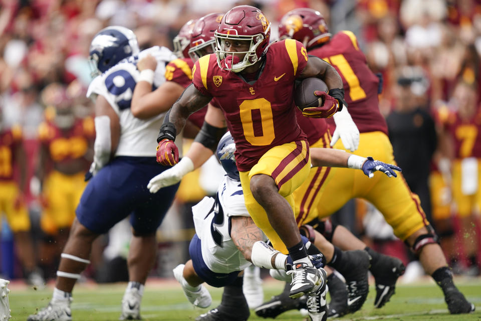 Southern California running back MarShawn Lloyd (0) runs the ball during the first half of an NCAA college football game against Nevada, Saturday, Sept. 2, 2023, in Los Angeles. (AP Photo/Ryan Sun)