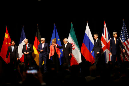 FILE PHOTO: Chinese Foreign Minister Wang Yi, French Foreign Minister Laurent Fabius, German Foreign Minister Frank Walter Steinmeier, High Representative of the European Union for Foreign Affairs and Security Policy Federica Mogherini, Iranian Foreign Minister Mohammad Javad Zarif, British Foreign Secretary Philip Hammond and U.S. Secretary of State John Kerry (L-R) arrive for a family picture after the last plenary session at the United Nations building in Vienna, Austria July 14, 2015. REUTERS/Leonhard Foeger/File Photo