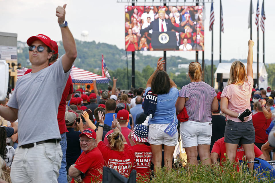 A standing room only crowd listens and cheers outside the arena during a speech by President Donald Trump Thursday, Aug. 1, 2019, in Cincinnati. 