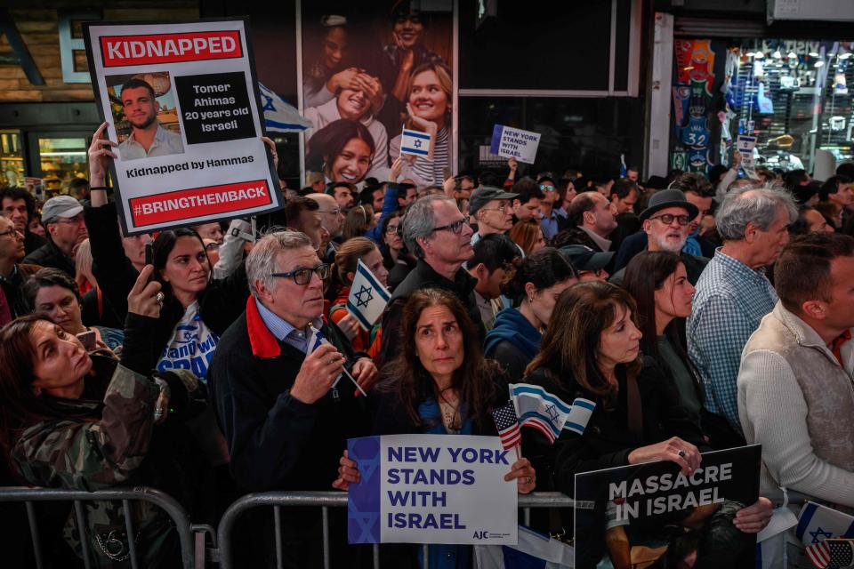 Members of the Jewish community and supporters of Israel attend a rally calling for the release of hostages held by Hamas, in Times Square, New York on October 19, 2023. The US intelligence community has estimated there were likely 100 to 300 people killed in the strike at the Ahli Arab hospital in Gaza, according to excerpts of a document seen October 19, 2023 by AFP -- far fewer than the nearly 500 deaths that health authorities in the Hamas-ruled enclave originally described.