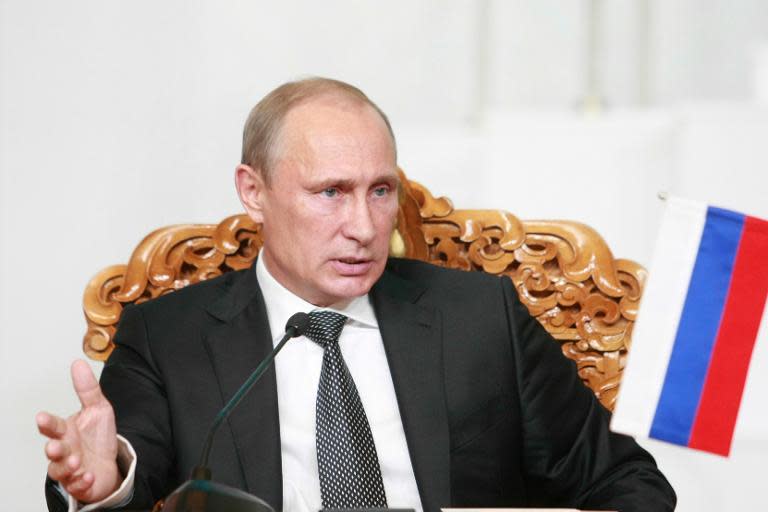 Russian President Vladimir Putin gestures as he talks on September 3, 2014