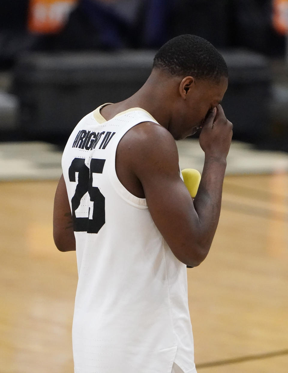 Colorado guard McKinley Wright IV fights back tears as he speaks during a ceremony for graduating seniors after the the team's NCAA college basketball game against UCLA on Saturday, Feb. 27, 2021, in Boulder, Colo. (AP Photo/David Zalubowski)