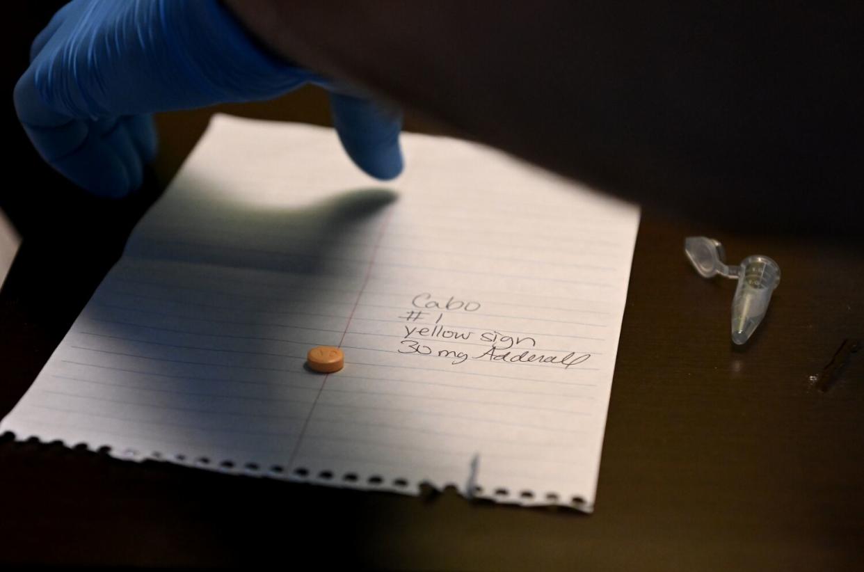 A pill on a piece of paper.