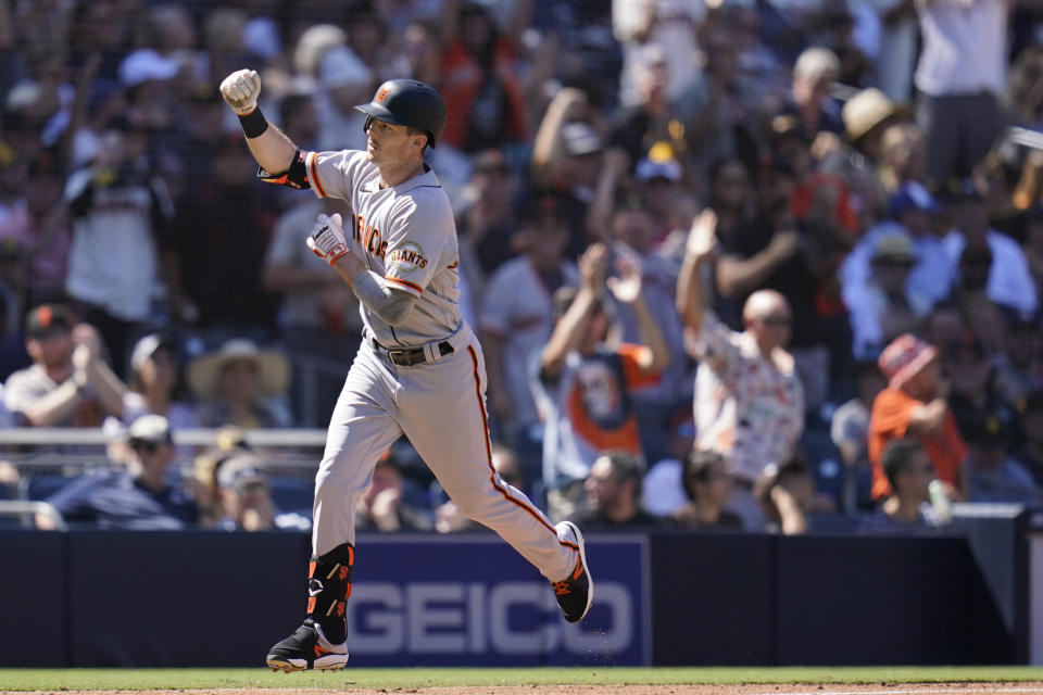 San Francisco Giants' Mike Yastrzemski, reacts after hitting a two-run home run during the second inning of a baseball game against the San Diego Padres, Thursday, Sept. 23, 2021, in San Diego. (AP Photo/Gregory Bull)