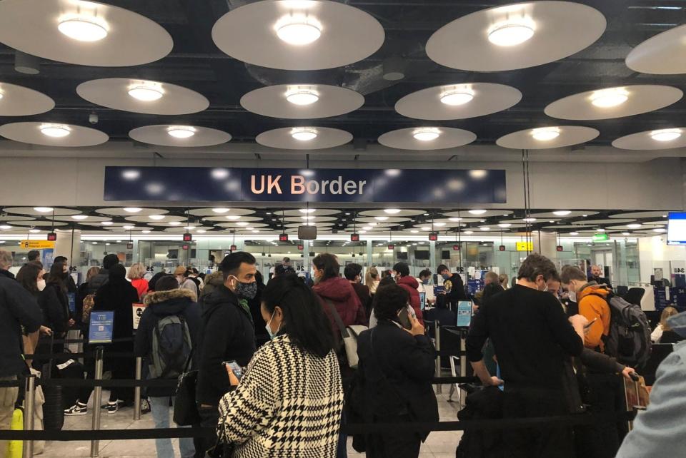 People queue at terminal 5 of Heathrow Airport, as the spread of the coronavirus disease continuesPIA JOSEPHSON via REUTERS