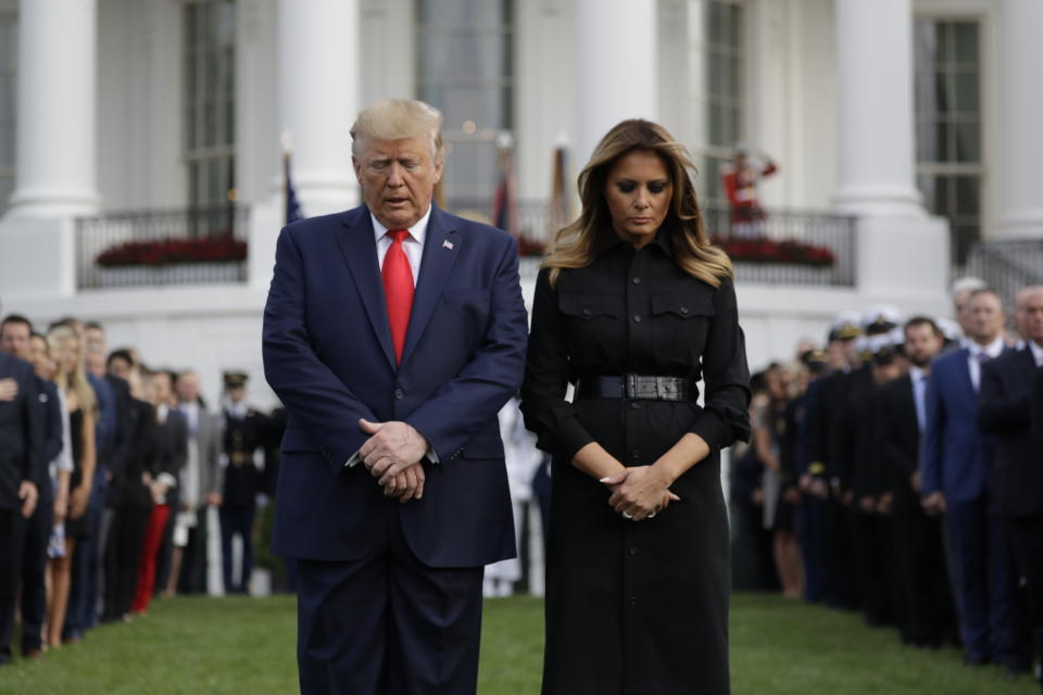 President Donald Trump and first lady Melania Trump participate in a moment of silence honoring the victims of the Sept. 11 terrorist attacks, on the South Lawn of the White House, Wednesday, Sept. 11, 2019, in Washington. (AP Photo/Evan Vucci)