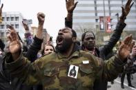 Demonstrators gesture near Camden Yards to protest against the death in police custody of Freddie Gray in Baltimore April 25, 2015. REUTERS/Sait Serkan Gurbuz