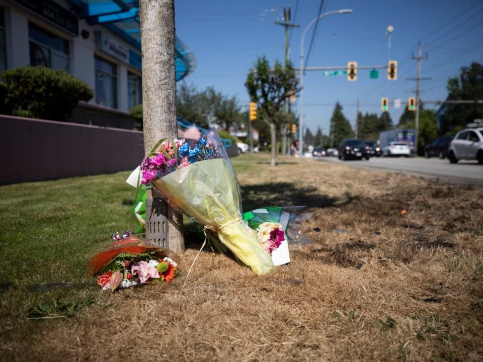 A memorial is pictured near 10th Avenue and Sixth Street on the Burnaby-New Westminster border after a crash that left two teens dead.  (Ben Nelms/CBC - image credit)