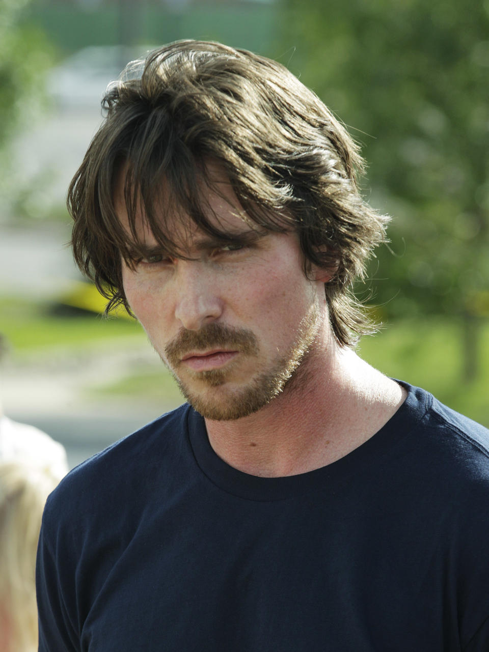 Actor Christian Bale visits a memorial to the victims of Friday's mass shooting, Tuesday, July 24, 2012, in Aurora, Colo. Twelve people were killed when a gunman opened fire during a late-night showing of the movie Dark Knight Rises, which stars Bale as Batman. (AP Photo/Ted S. Warren)