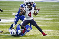 Houston Texans quarterback Deshaun Watson (4) runs against the Indianapolis Colts in the second half of an NFL football game in Indianapolis, Sunday, Dec. 20, 2020. (AP Photo/Darron Cummings)