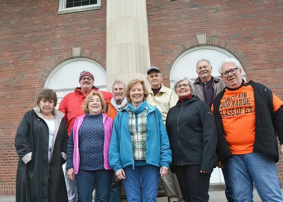 The 1963 Northside High School class posed for a picture on the steps of the former high school in December of 2017, two months before the demolition of the 96,400-square foot site began.  Back row from left, Paul Mayo, Doug Benjamin, Dill Reilly and Bob Yorio. Front row from the left, Kathy Mayo, Julie Borel Errett, Joan McLaughlin Cook, Gail Smith Cook and Bob Narde.