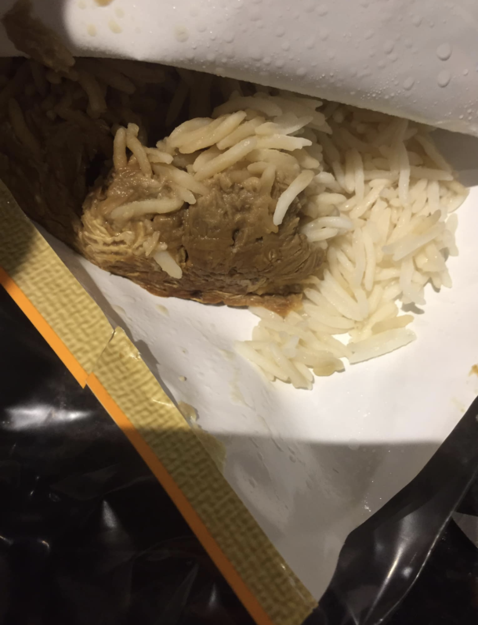 Photo shows inside of ALDI rice and brown sludge. 