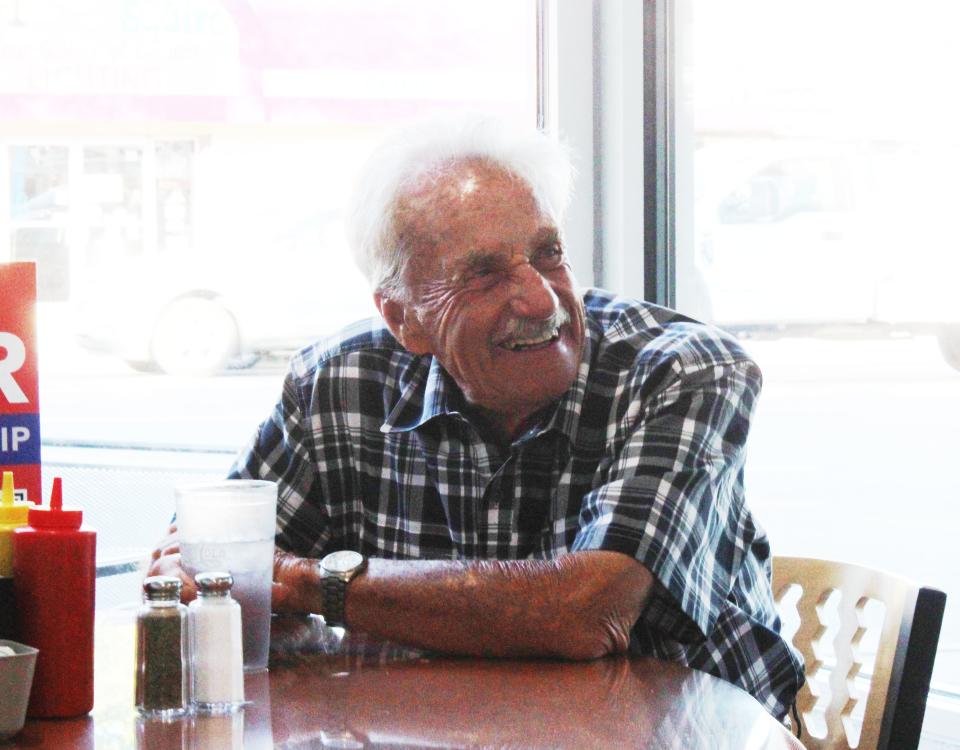 Gerald Knight smiles from ear to ear after learning that he has been chosen as the 2022 Howell Melon Festival Grand Marshal at Mark's Midtown Coney on Tuesday, June 28, 2022.