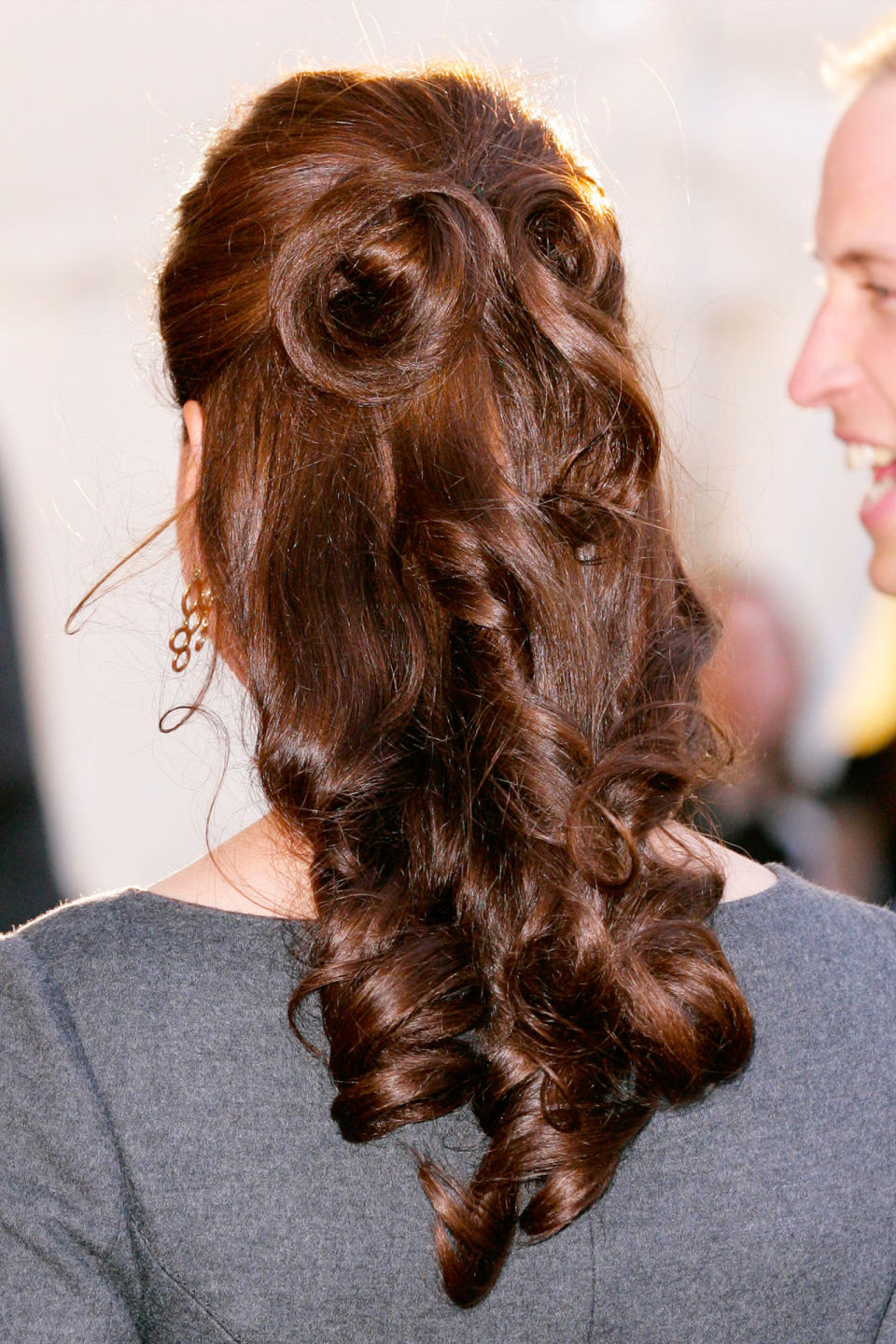 <p>Kate twisted the ends of her half-up to create a swirled look, secured with seemingly invisible bobby pins. </p>