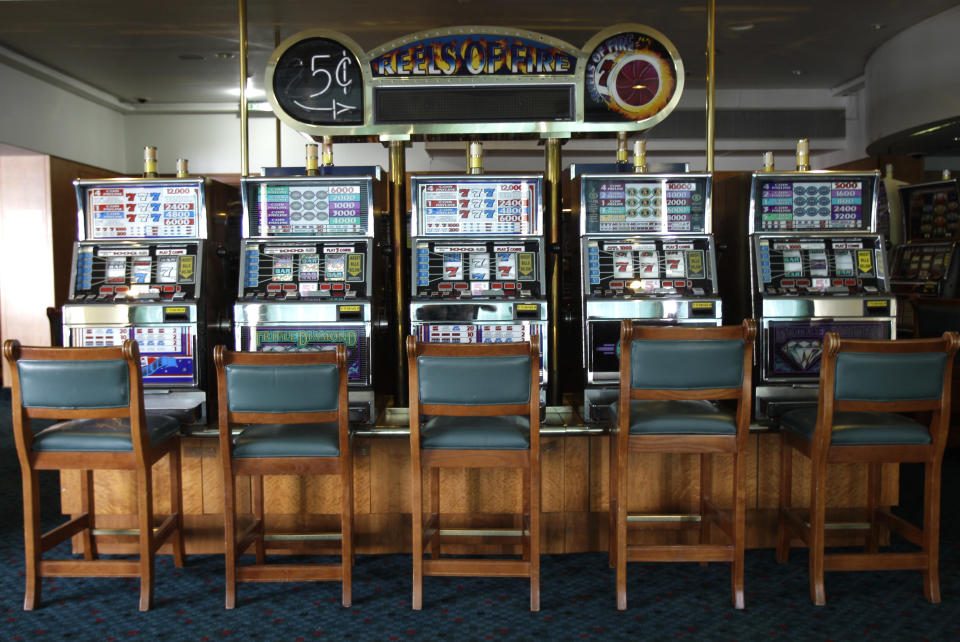 Slot machines are seen in the casino aboard the Queen Elizabeth 2 as Istithmar World, the Dubai state investment company that owns the ship, outlined plans Monday to turn the retired cruise liner into a 300-room hotel, ending years of speculation about its fate, in Port Rashid, Dubai, United Arab Emirates, Monday, July 2, 2012. Britain's Queen Elizabeth II launched the QE2 in 1967. (AP Photo/Kamran Jebreili)