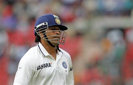 India's Sachin Tendulkar reacts as he walks back to the pavilion after being dismissed by New Zealand's Jeetan Patel during the fourth day of their second test cricket match in Bangalore, September 3, 2012. REUTERS/Vivek Prakash