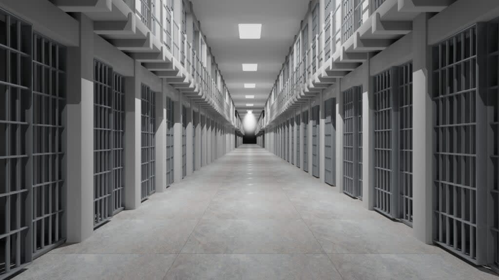 Rows of prison cells, prison interior.