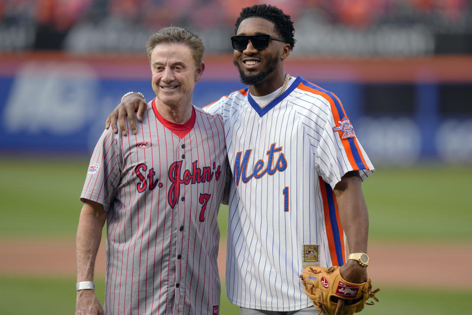 St. John's men's basketball coach Rick Pitino, left, poses for photos with Cleveland Cavaliers' Donavan Mitchell before a baseball game between the New York Mets and the New York Yankees Tuesday, June 13, 2023, in New York. (AP Photo/Frank Franklin II)