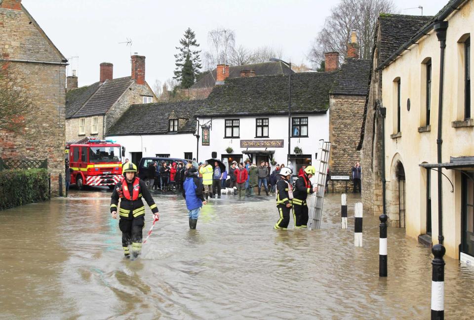 Flood scenes in Malmesbury, Wilts., where firefighters rescued three people trapped in the upper floors of a period home (SWNS)