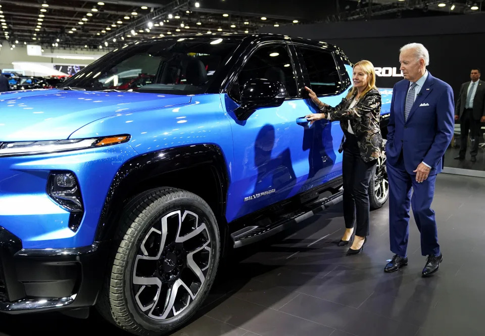 U.S. President Joe Biden is shown a Chevrolet Silverado EV by General Motors Chief Executive Mary Barra during a visit to the Detroit Auto Show to highlight electric vehicle manufacturing in America, in Detroit, Michigan, U.S., September 14, 2022. REUTERS/Kevin Lamarque