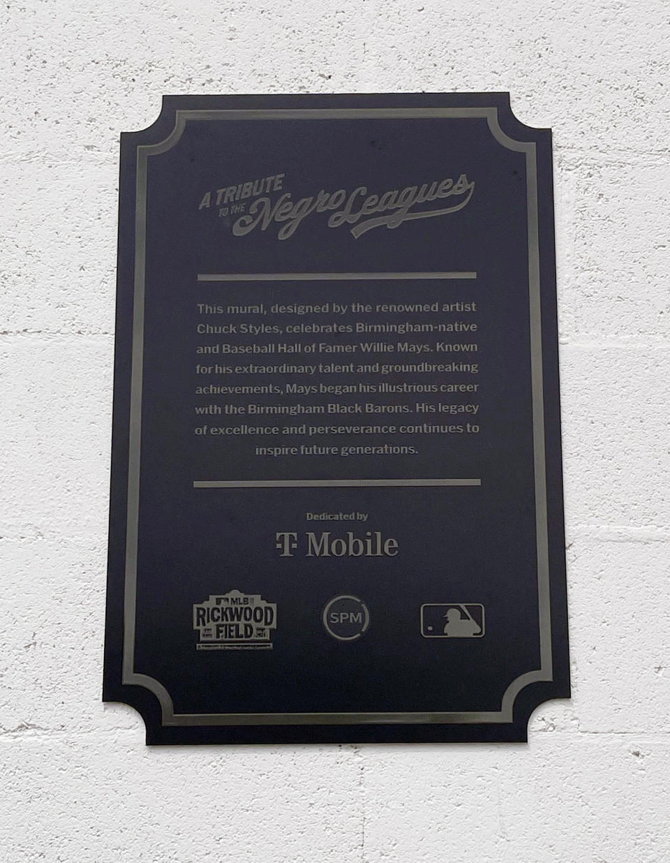 A plaque is shown on the Willie Mays mural in Wednesday, June 19, 2024 in downtown Birmingham, Ala. A mural honoring baseball Hall of Famer Willie Mays has been unveiled in downtown Birmingham, Alabama. Mays died Tuesday at the age of 93.(AP Photo/Alanis Thames).