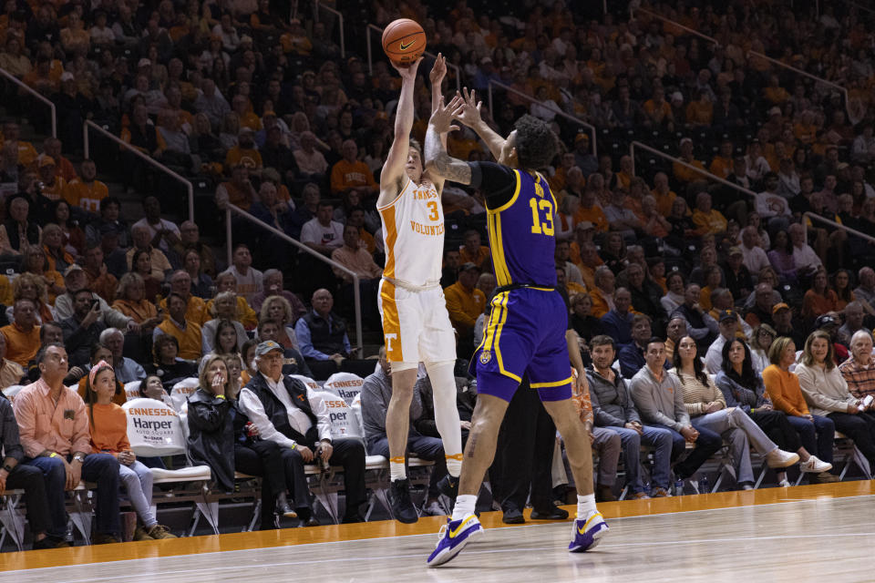 Tennessee guard Dalton Knecht (3) shoots over LSU forward Jalen Reed (13) during the first half of an NCAA college basketball game Wednesday, Feb. 7, 2024, in Knoxville, Tenn. (AP Photo/Wade Payne)