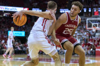 Wisconsin's Tyler Wahl (5) maneuvers around Indiana's Race Thompson (25) during the first half of an NCAA college basketball game Wednesday, Dec. 8, 2021, in Madison, Wis. (AP Photo/Andy Manis)