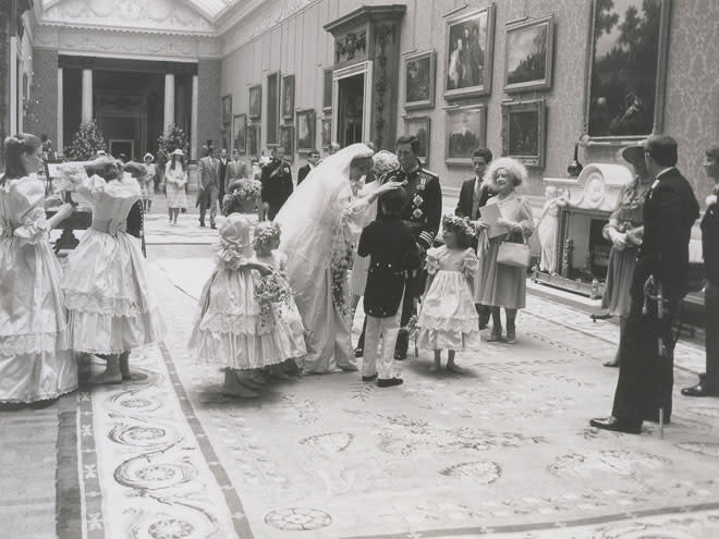 <p>Dubbed the "wedding of the century," Charles and Diana's nuptials were attended by the royal family at home, and others abroad. Here, the Queen Mother looks on as Diana and Charles speak with their attendants.</p>