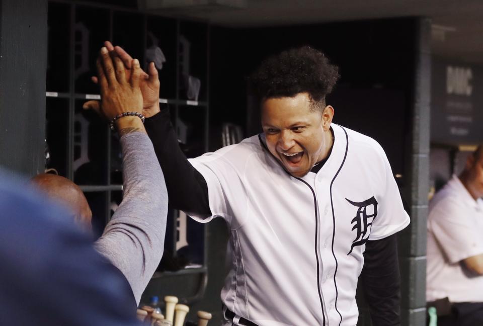Detroit Tigers designated hitter Miguel Cabrera greets a teammate after hitting a grand slam during the fifth inning of the team's baseball game against the Tampa Bay Rays, Tuesday, June 4, 2019, in Detroit. (AP Photo/Carlos Osorio)