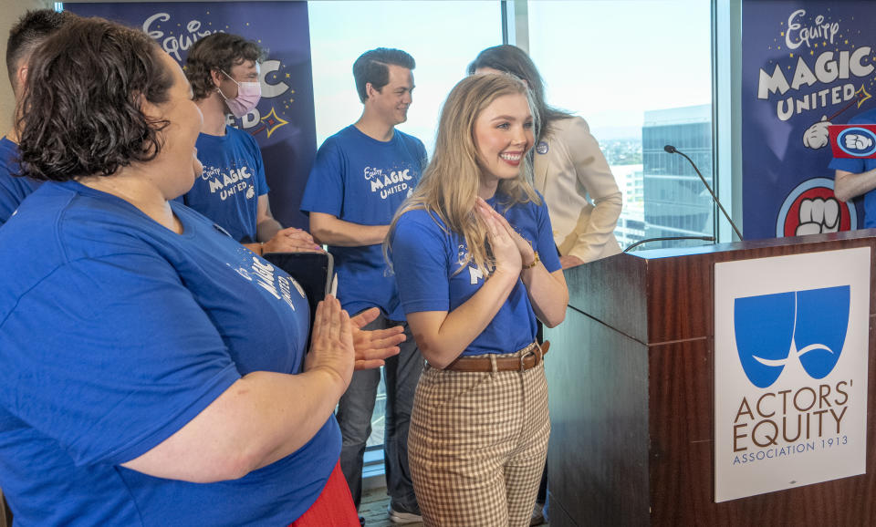 Actors Angela Nichols, far left, and Courtney Griffith, center, and workers who help bring Disneyland's beloved characters to life as they announce they've collected enough signatures to support their push for a union during a news conference in Anaheim, Calif., Wednesday, April 17, 2024. Workers who help bring Disneyland's beloved characters to life said Wednesday they collected enough signatures to support their push for a union. (AP Photo/Damian Dovarganes)