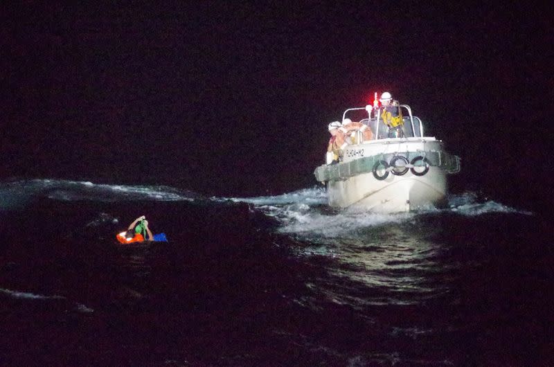 A Filipino crew member believed to be onboard Gulf Livestock 1 is rescued by Japan Coast Guard boat during their search and rescue operation at the East China Sea following Typhoon Maysak