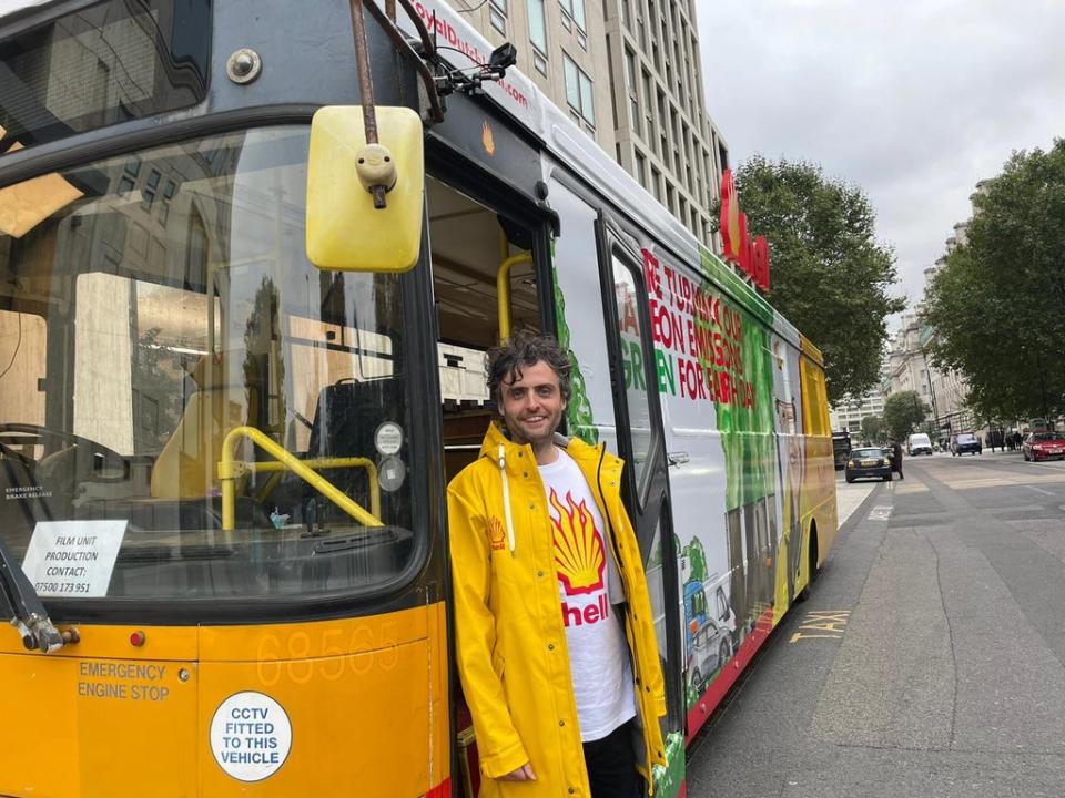 Darren Cullen, the artist who created the mural on the bus, poses outside of the Shell offices. (Isobel Frodsham/PA) (PA)
