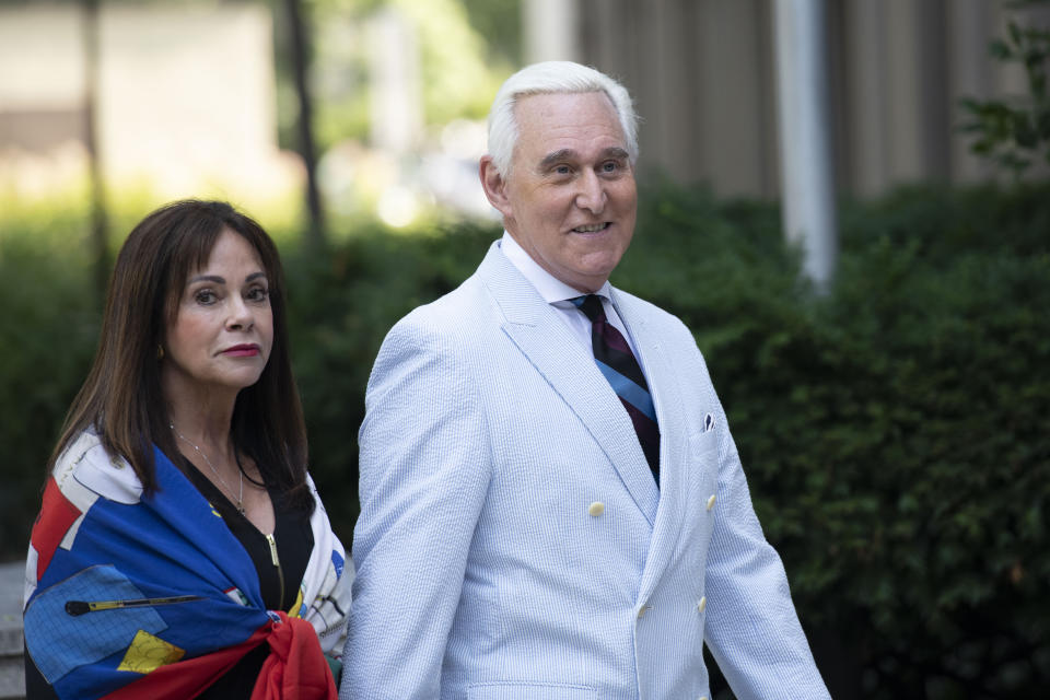 Roger Stone, a longtime confidant of President Donald Trump, accompanied by his wife Nydia Stone, left, arrives at federal court in Washington, Tuesday, July 16, 2019. (AP Photo/Sait Serkan Gurbuz)