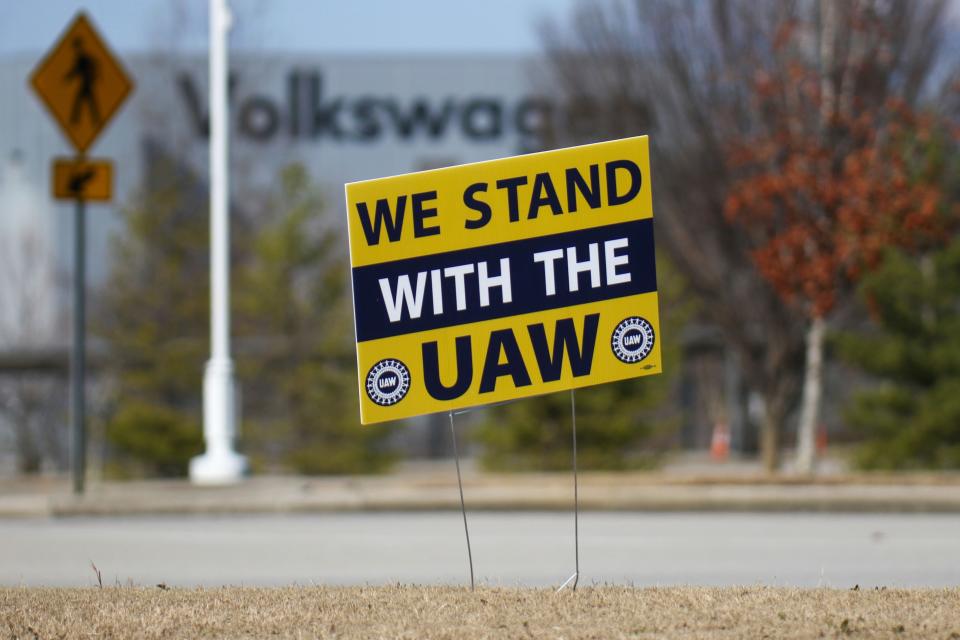 A "We stand with the UAW" sign is placed outside of the Volkswagen plant in Chattanooga, Tenn., on Monday, Dec. 18, 2023. UAW President Shawn Fain visited the plant with Volkswagen workers, community and faith leaders, and CALEB (Chattanoogans in Action for Love, Equality, and Benevolence). The group delivered a letter to Volkswagen management, "demanding the company end its union-busting and intimidation."