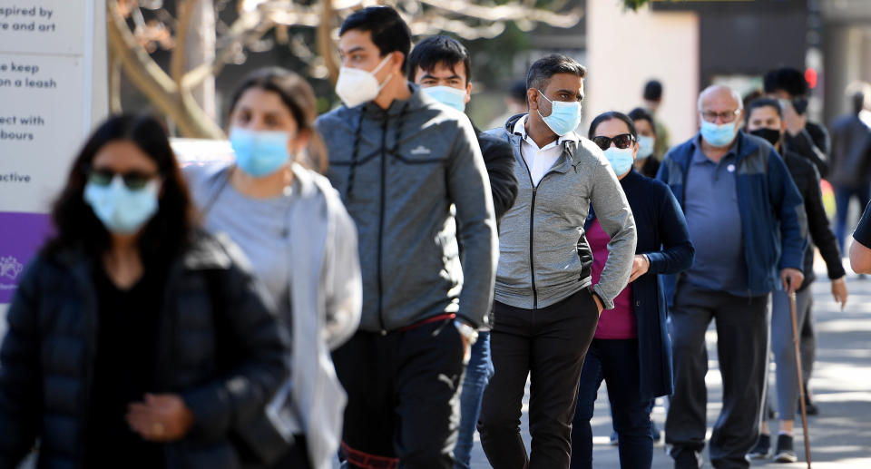 People wait in line to get vaccinated at a Covid vaccination clinic at Olympic Park, Sydney, Wednesday, August 18, 2021. Source: AAP