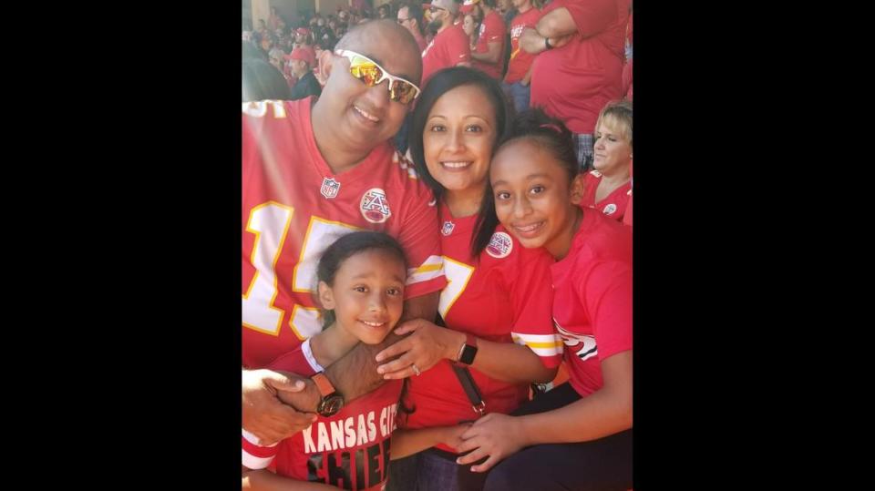 Jason Madhu is pictured with wife, Deepa, and daughters Rianna and Maleena. To honor his mother’s memory, Madhu is flying a single mother from Chicago to Sunday’s Chiefs game with her son.