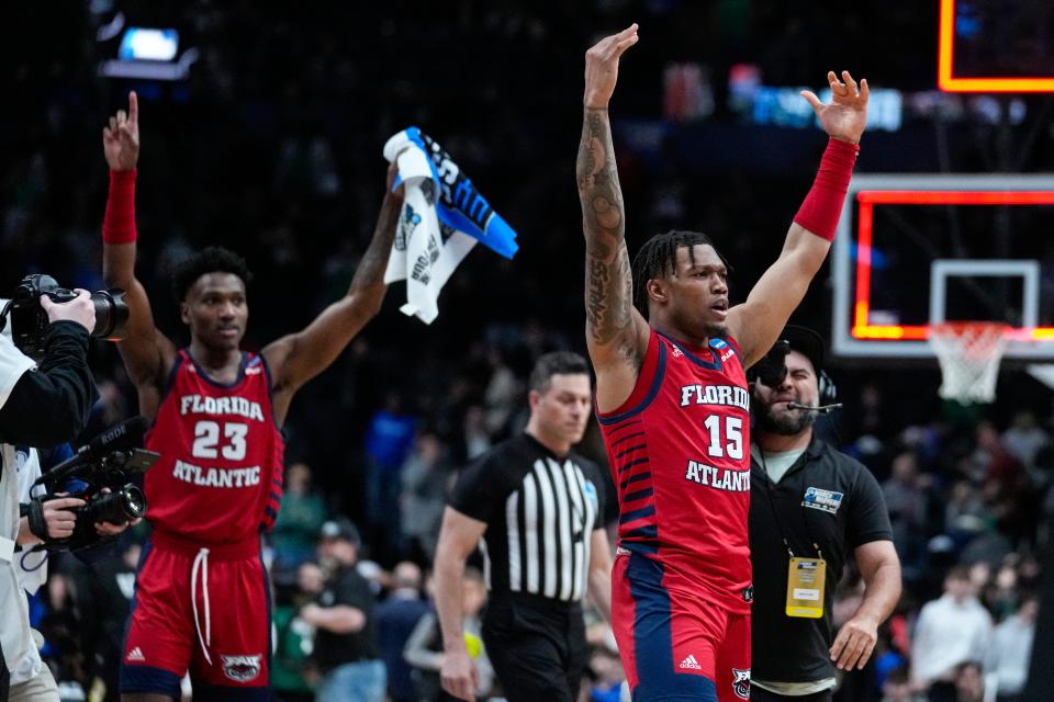 Florida Atlantic guard Alijah Martin (15) and guard Brandon Weatherspoon (23) celebrate after defeating Memphis 66-65 in a first-round college basketball game in the men's NCAA Tournament in Columbus, Ohio, Friday, March 17, 2023. (AP Photo/Michael Conroy)