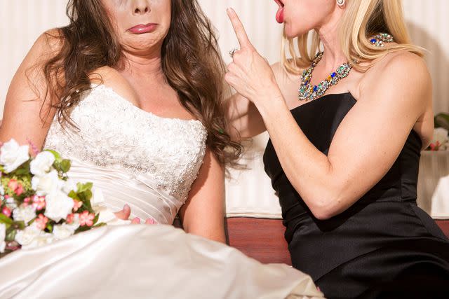 <p>CREATISTA/Getty</p> A bride and a woman arguing (stock image)