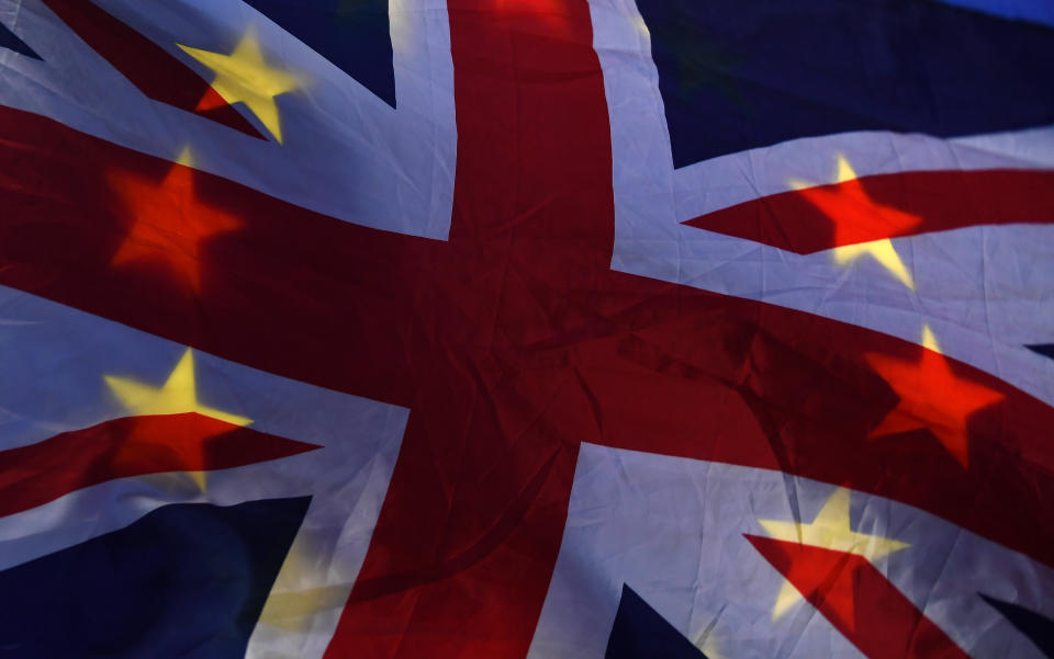 A flag depicting the British Union Jack design and the EU design is seen outside of the Houses of Parliament in London, Britain, January 14, 2019. Photo: REUTERS/Clodagh Kilcoyne