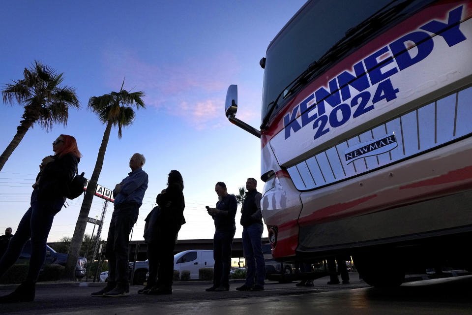 Voters wait to enter a voter rally for Independent presidential candidate Robert F. Kennedy Jr., Wednesday, Dec. 20, 2023, in Phoenix. (AP Photo/Matt York)