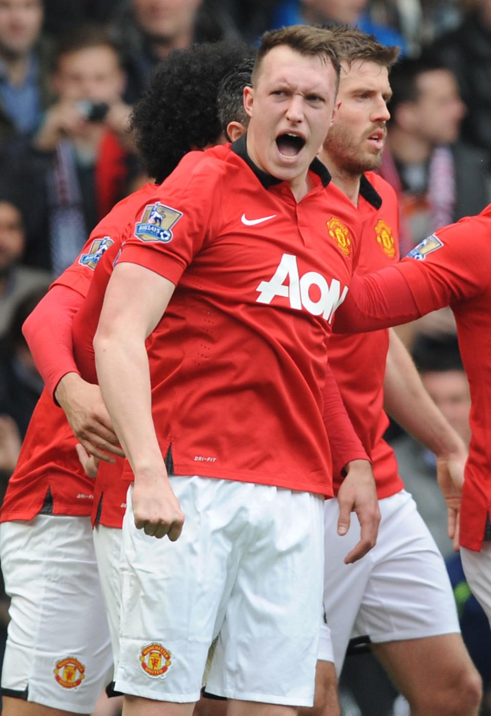 Manchester United's Phil Jones celebrates after scoring against West Brom during the English Premier League soccer match between West Bromwich Albion and Manchester United at The Hawthorns Stadium in West Bromwich, England, Saturday, March 8, 2014. (AP Photo/Rui Vieira)
