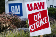 A sign is posted during a demonstration outside a General Motors facility in Langhorne, Pa., Monday, Sept. 23, 2019. The strike against General Motors by 49,000 United Auto Workers entered its second week Monday with progress reported in negotiations but no clear end in sight. (AP Photo/Matt Rourke)