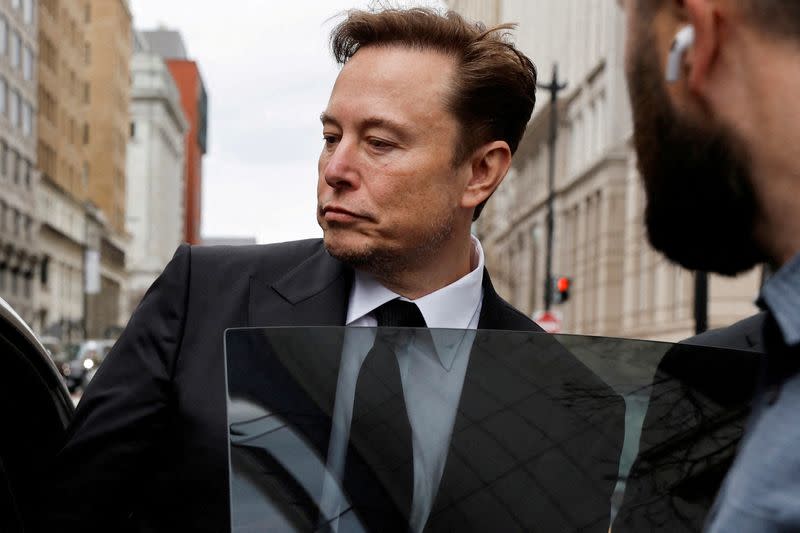 FILE PHOTO: Tesla CEO Musk departs the company’s local office in Washington