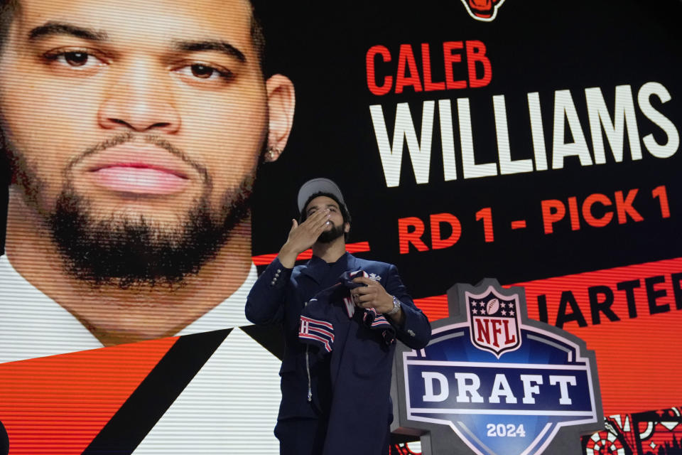 Southern California quarterback Caleb Williams celebrates after being chosen by the Chicago Bears with the first overall pick during the first round of the NFL football draft, Thursday, April 25, 2024, in Detroit. (AP Photo/Jeff Roberson)