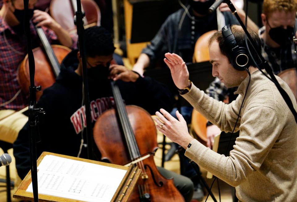 Conductor Daniel Slatkin, works on a score with the Detroit Symphony Orchestra for the documentary "Gradually, Then Suddenly: The Bankruptcy of Detroit" at DSO in Detroit on Dec. 6, 2021.