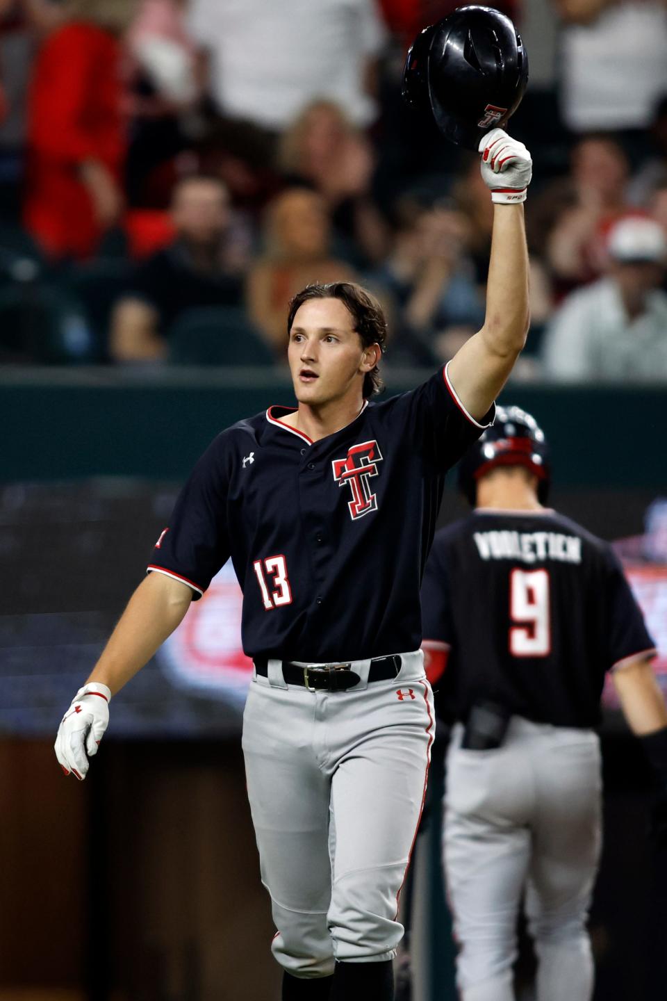 Texas Tech’s Gavin Kash (13) provides a hat tip to the crowd after hitting his 24th home run of the season during a first-round game against West Virginia in the Big 12 Conference Tournament on Wednesday, May 24, 2023, at Globe Life Field in Arlington, Texas.