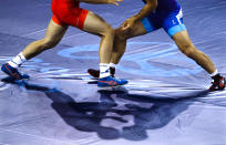<p>China’s Yang Bin, red, competes against Morocco ‘s Zied Ait Ouagram during the during the men’s Greco-Roman competition at the 2016 Summer Olympics in Rio de Janeiro, Brazil, Sunday, Aug. 14, 2016. (AP Photo/Markus Schreiber) </p>