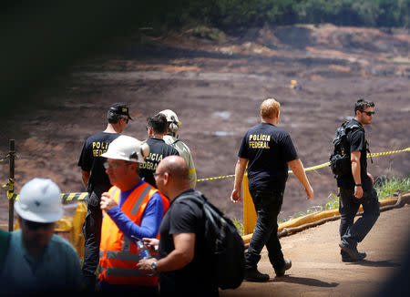 Federal police officers are seen at the collapsed Brazilian mining company Vale SA, in Brumadinho, Brazil February 1, 2019. REUTERS/Adriano Machado