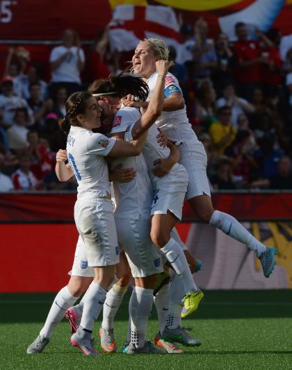 From left, England&#39;s Karen Carney, Lucy Bronze, Fara Williams and Steph Houghton celebrate Bronze&#39;s goal against Norway during second half FIFA Women&#39;s World Cup round of 16 soccer action in Ottawa, Ontario, Canada, on Monday, June 22, 2015. (Sean Kilpatrick/The Canadian Press via AP) MANDATORY CREDIT